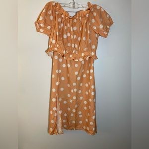 Two piece polka dot skirt and crop top. Can wear off shoulder top. Size L